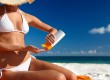 Lady putting on sunscreen