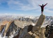 Man standing on edge of cliff