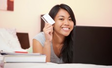 Student holding credit card