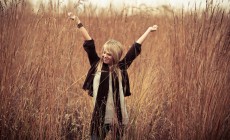 Woman stretching in wheat field