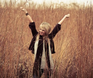 Woman stretching in wheat field