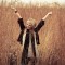 Woman stretching in wheat field