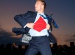 Man in suit with Superman shirt