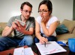 Young couple calculating budget