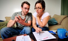 Young couple calculating budget