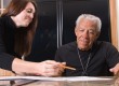 Financial adviser helping elderly man with retirement benefits