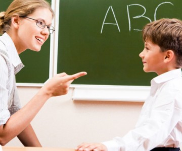 Teacher explaining grammar to student