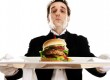 Butler serving a burger