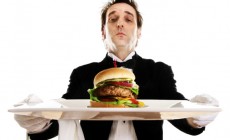 Butler serving a burger