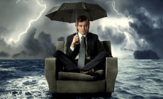 Man stranded at sea with umbrella