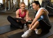 Woman with trainer at gym