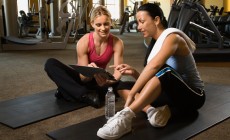 Woman with trainer at gym