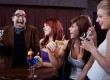 Man making women laugh at nightclub