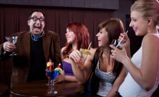 Man making women laugh at nightclub