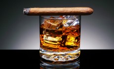 Cigar on top of alcoholic drink
