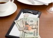 Guest check with cash and coin