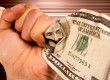 Hand holding dollars