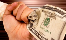 Hand holding dollars