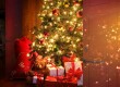 Christmas tree with fireplace in background