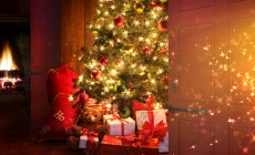 Christmas tree with fireplace in background