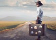 Young guy of countryside holding a suitcase
