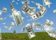 money falling in the sky and green grass background
