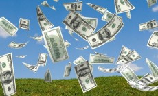 money falling in the sky and green grass background