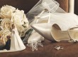 Bouquet of white roses and wedding shoes on chair