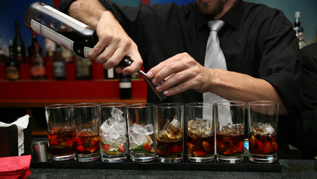Bartender pouring drinks
