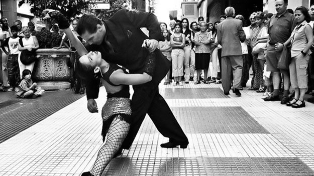 Couple dancing tango in streets
