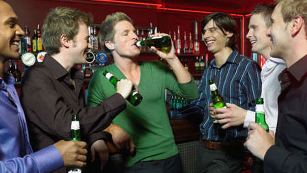 Guys drinking at pub
