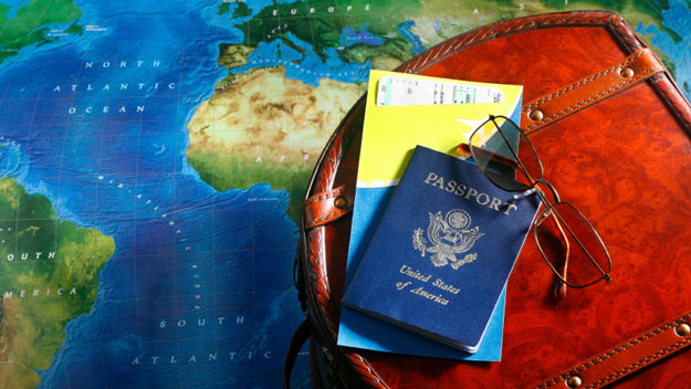 Map, suitcase and passport