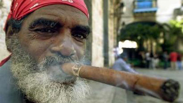 Smoking a big Cuban cigar in Old Havana