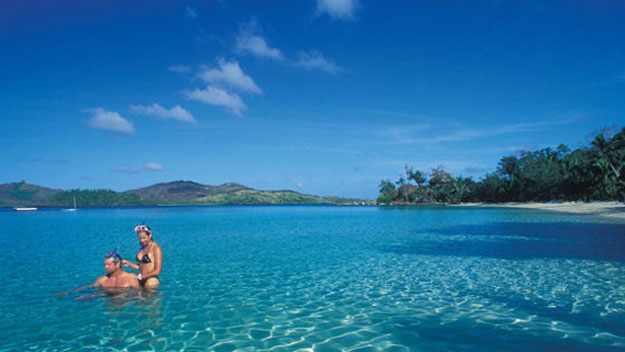 Couple swimming at Turtle Island, Fiji