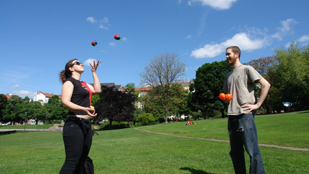 Woman attempting to juggle