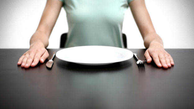 Woman with empty plate