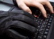 Hacker hands on laptop keyboard