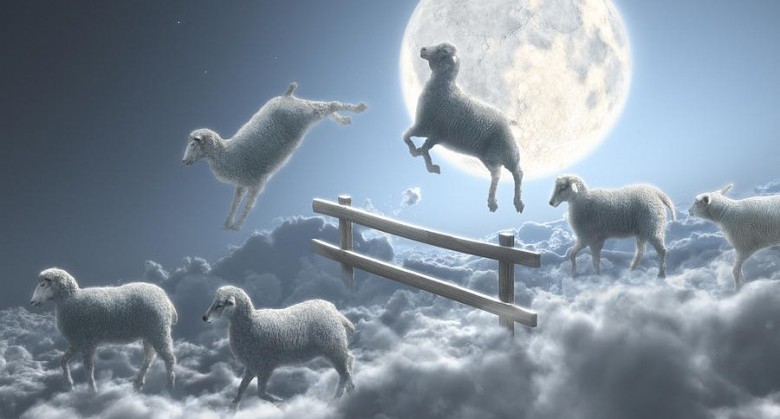 sheep-jumping-over-fence-in-a-cloudy-moon-scene-dieter-spannknebel