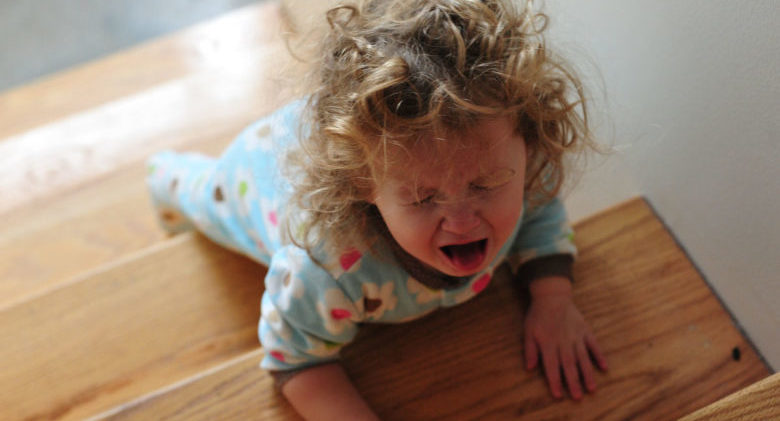 Toddler-crying-on-stairs