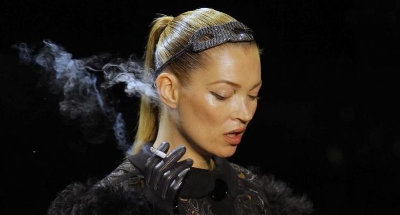 British model Kate Moss wears a creation by American fashion designer Marc Jacobs for Louis Vuitton's Fall-Winter, ready-to-wear 2012 fashion collection, during Paris Fashion week, presented in Paris, Wednesday, March. 9, 2011. (AP Photo/Jacques Brinon)