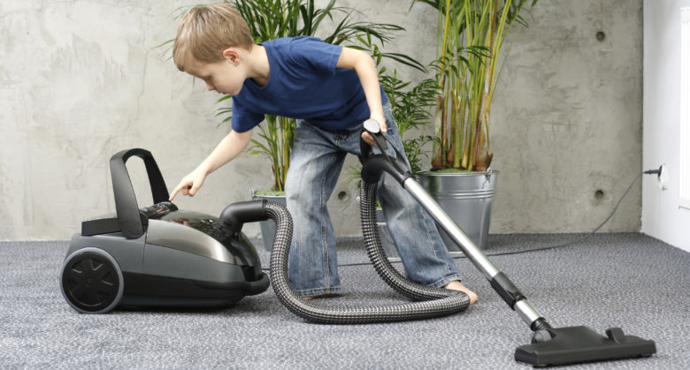 4-5 years old boy cleaning carper - housework