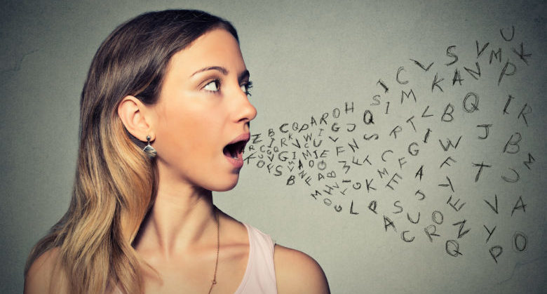 Woman talking with alphabet letters coming out of her mouth. Communication, information, intelligence concept