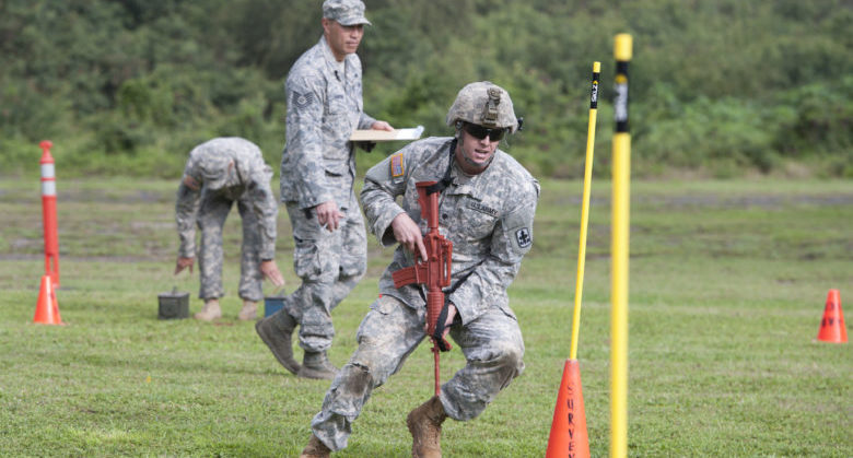 U.S. Army Spc. Cruser Barnes, 1st Squadron, 299th Cavalry Regiment, Hawaii Army National Guard (HIARNG), maneuvers through obstacles during a combat army readiness test as part of the 2015 Hawaii Army National Guard and Reserve Best Warrior Competition March 6, 2015, at Marine Corps Training Area Bellows, Hawaii. Competitors included eight Soldiers from the U.S. Army National Guard and 13 Soldiers from the U.S. Army Reserve assigned to units throughout the Pacific Region. (U.S. Air Force photo by Staff Sgt. Christopher Hubenthal)