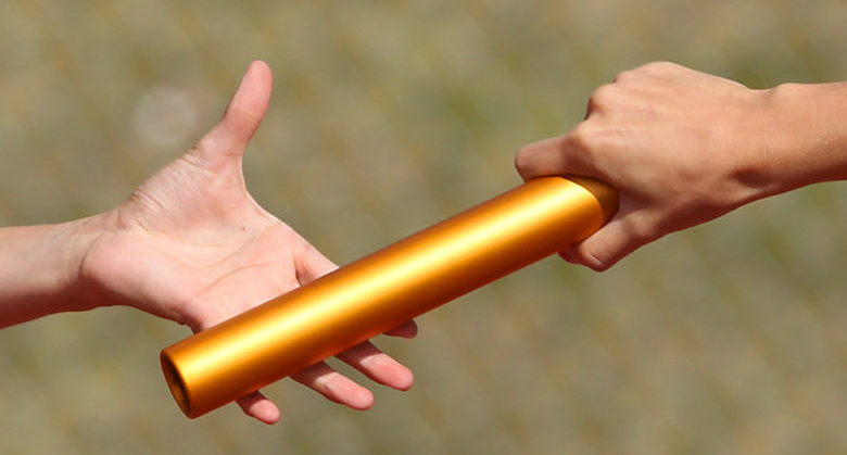 The baton is passed between runners for Wheatland High School during the girls 3A 4 X 800 meter relay finals of the 2012 Wyoming Track and Field Championships at Harry Geldien Stadium in Casper Saturday afternoon. Michael Smith/Wyoming Tribune Eagle