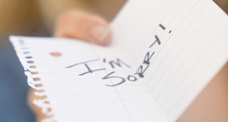 USA, New Jersey, Jersey City, Close up of woman showing apologize message