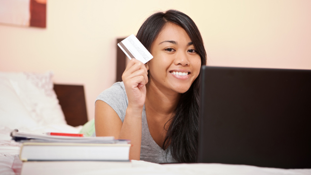 Student holding credit card