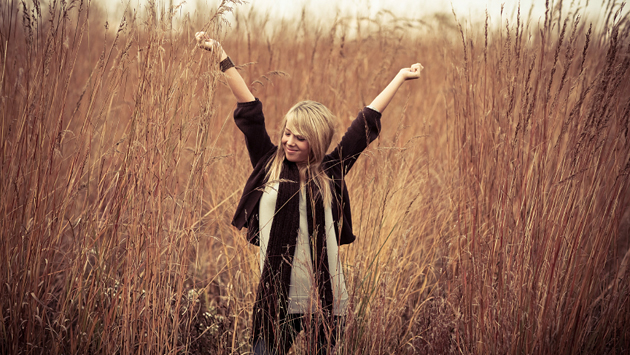 Woman stretching in wheat field