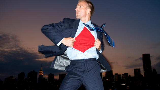 Man in suit with Superman shirt