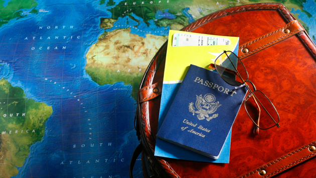Suitcase, passport and map
